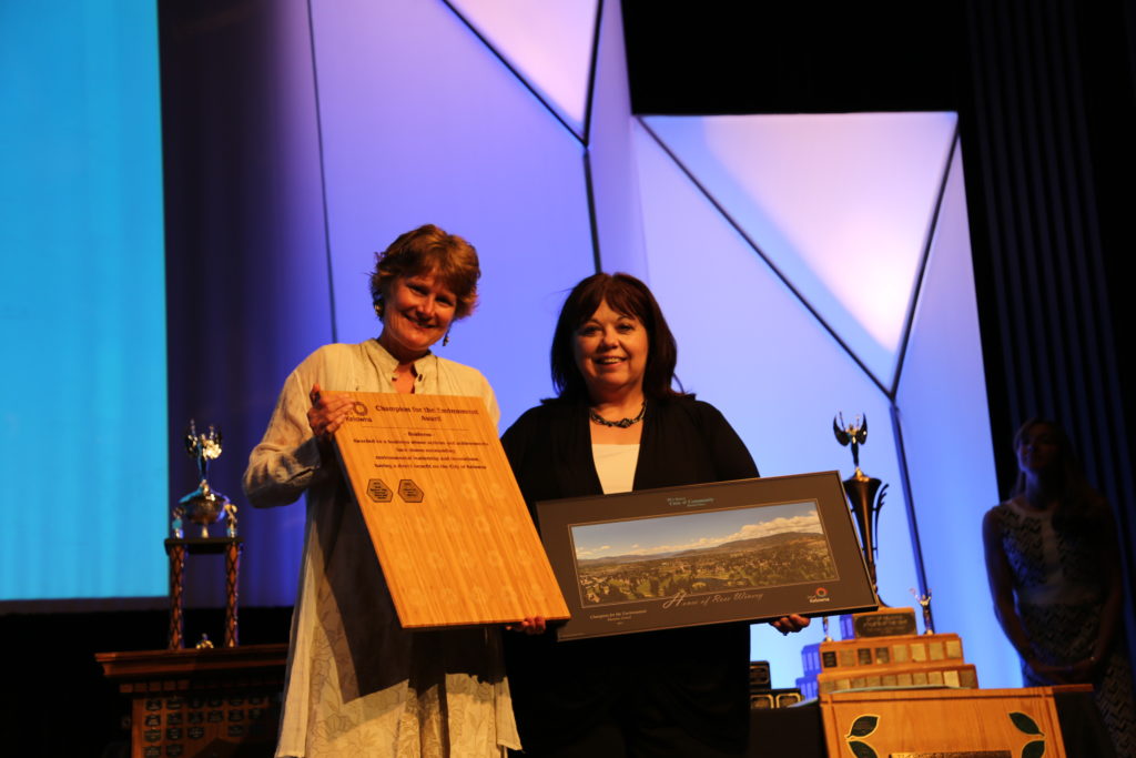 Aura Rose House or Rose Winery winning City award with presentor Brenda Rayburn from the Best Western-1